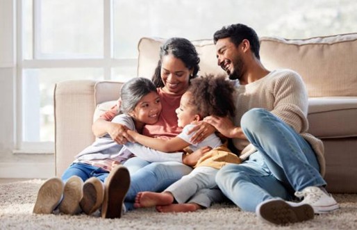Family sitting together on floor
